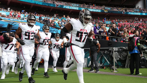 Oct 1, 2023; London, United Kingdom; Atlanta Falcons defensive end Grady Jarrett (97), defensive tackle Calais Campbell (93) and guard Matthew Bergeron (65) enter the field during an NFL International Series game against the Jacksonville Jaguars at Wembley Stadium. Mandatory Credit: Kirby Lee-USA TODAY Sports